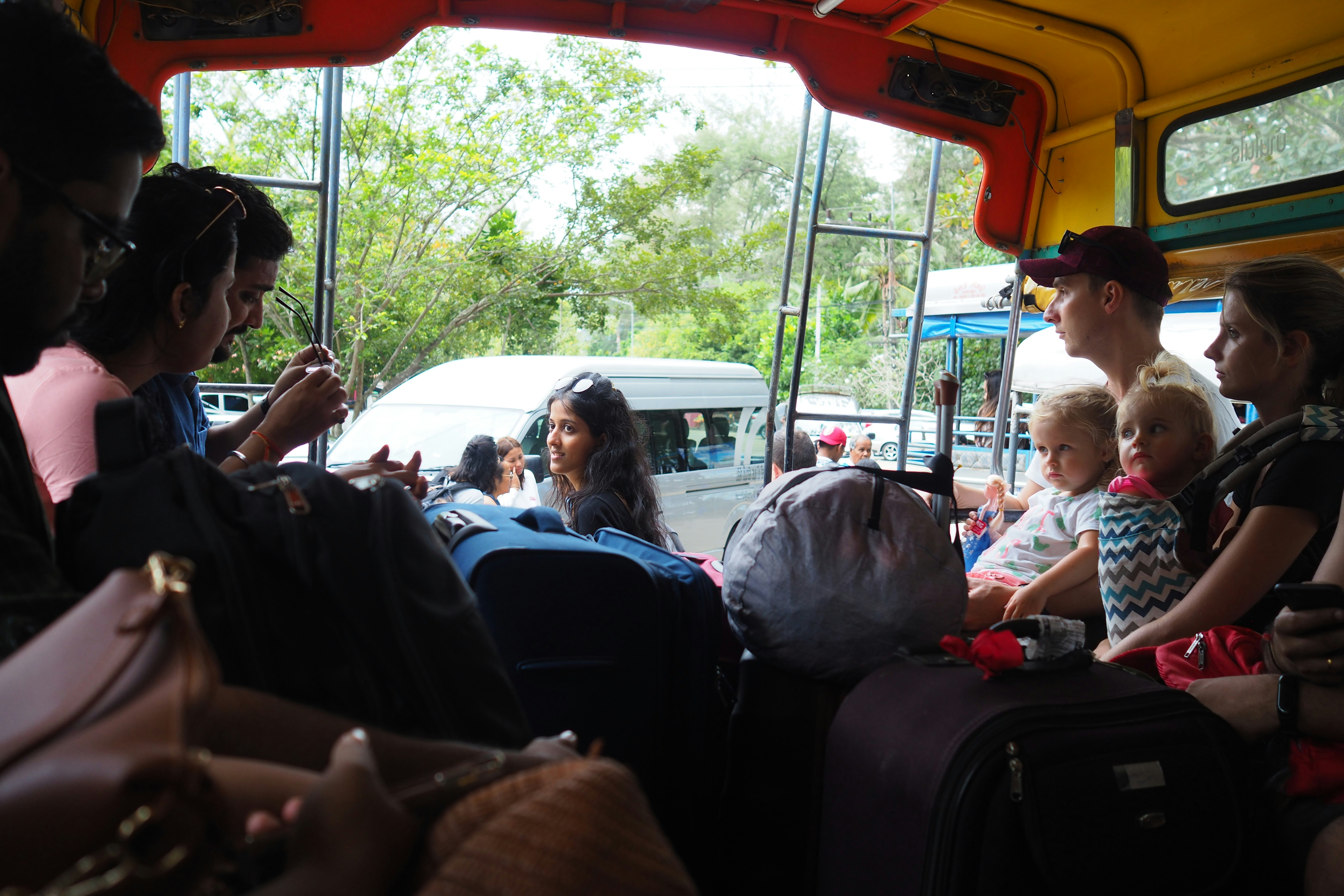 people sitting on bus seat during daytime