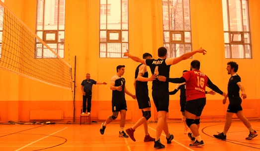 group of men playing basketball