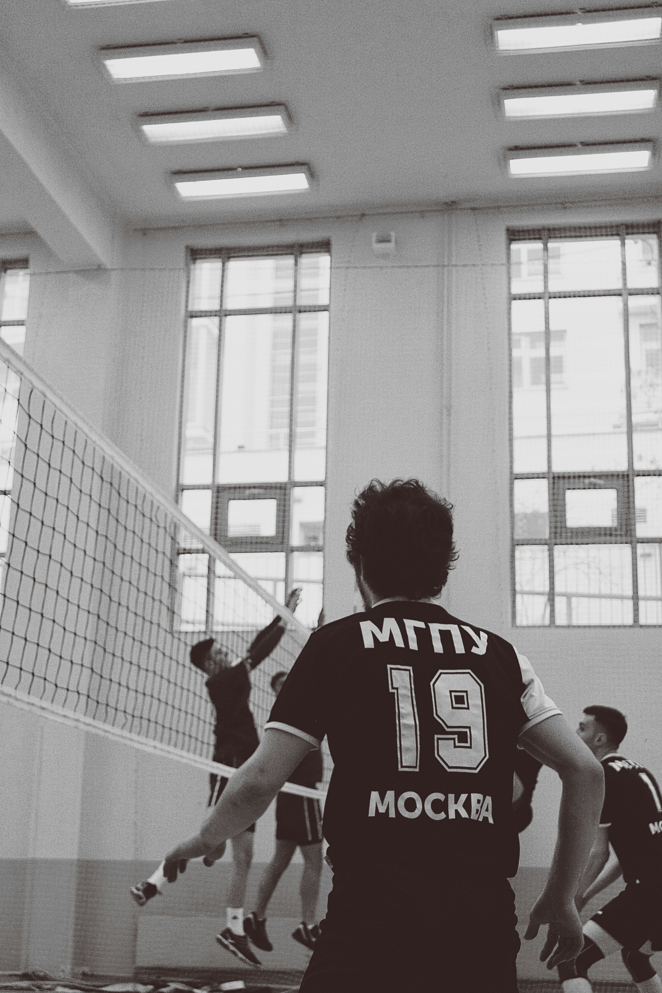 man in red and white jersey shirt
