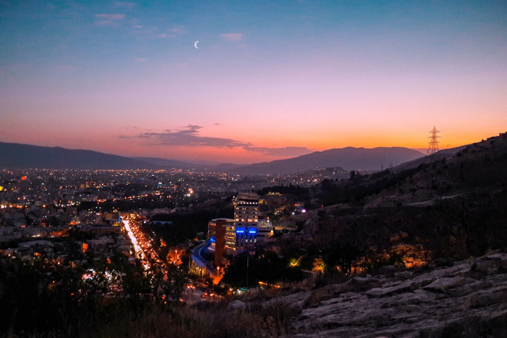 city with high rise buildings during night time