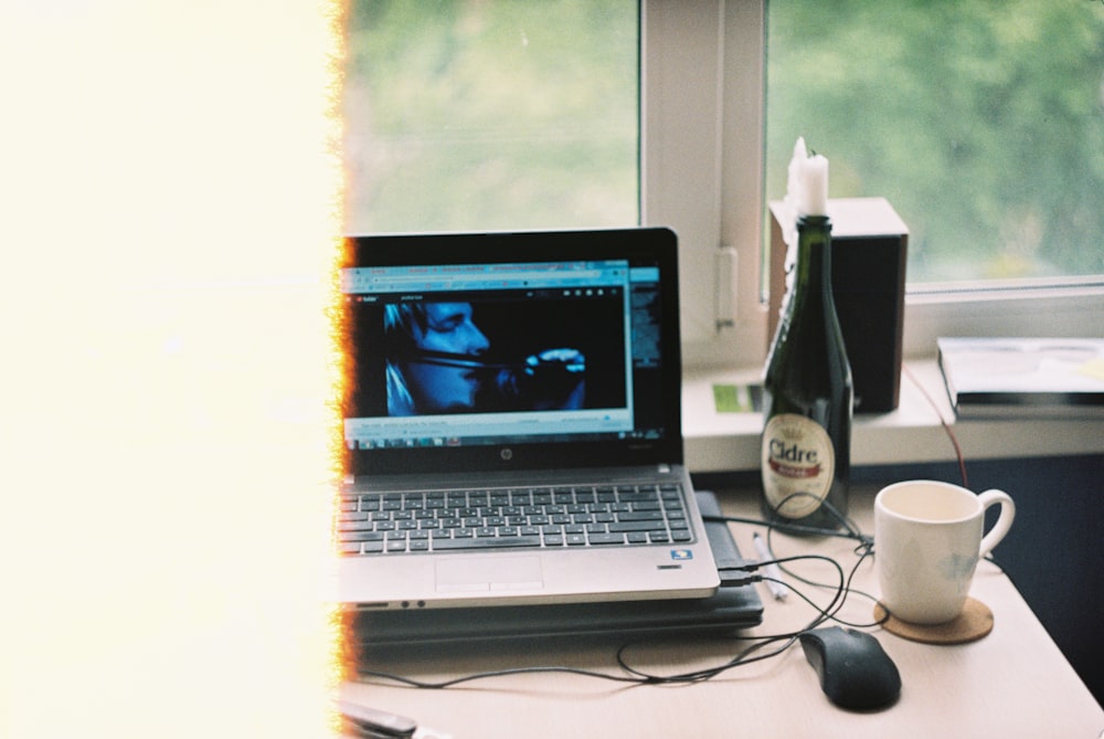 macbook pro on brown wooden table