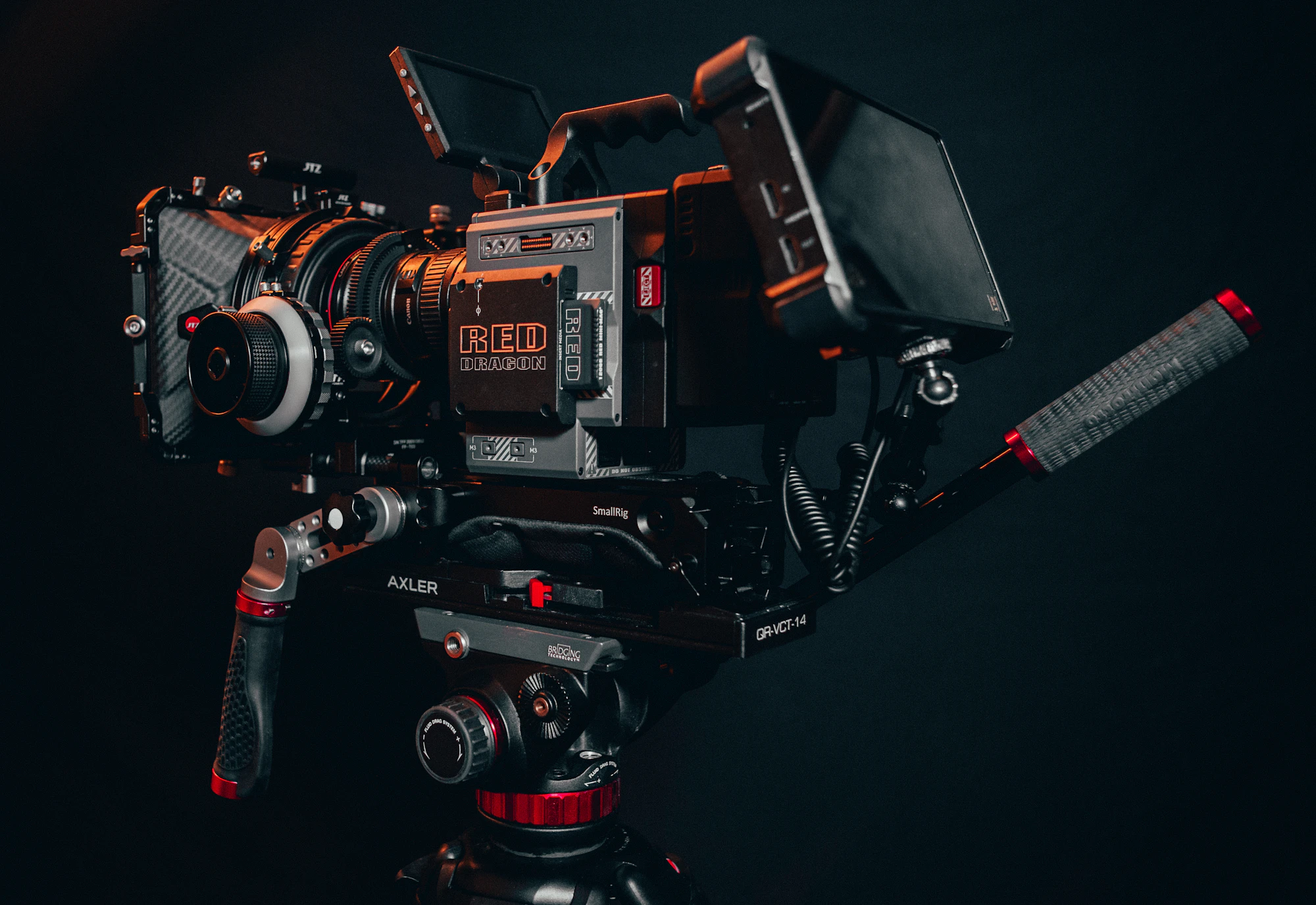 A cinema camera resting in low light against near-darkness — ten years of work, frame by frame.