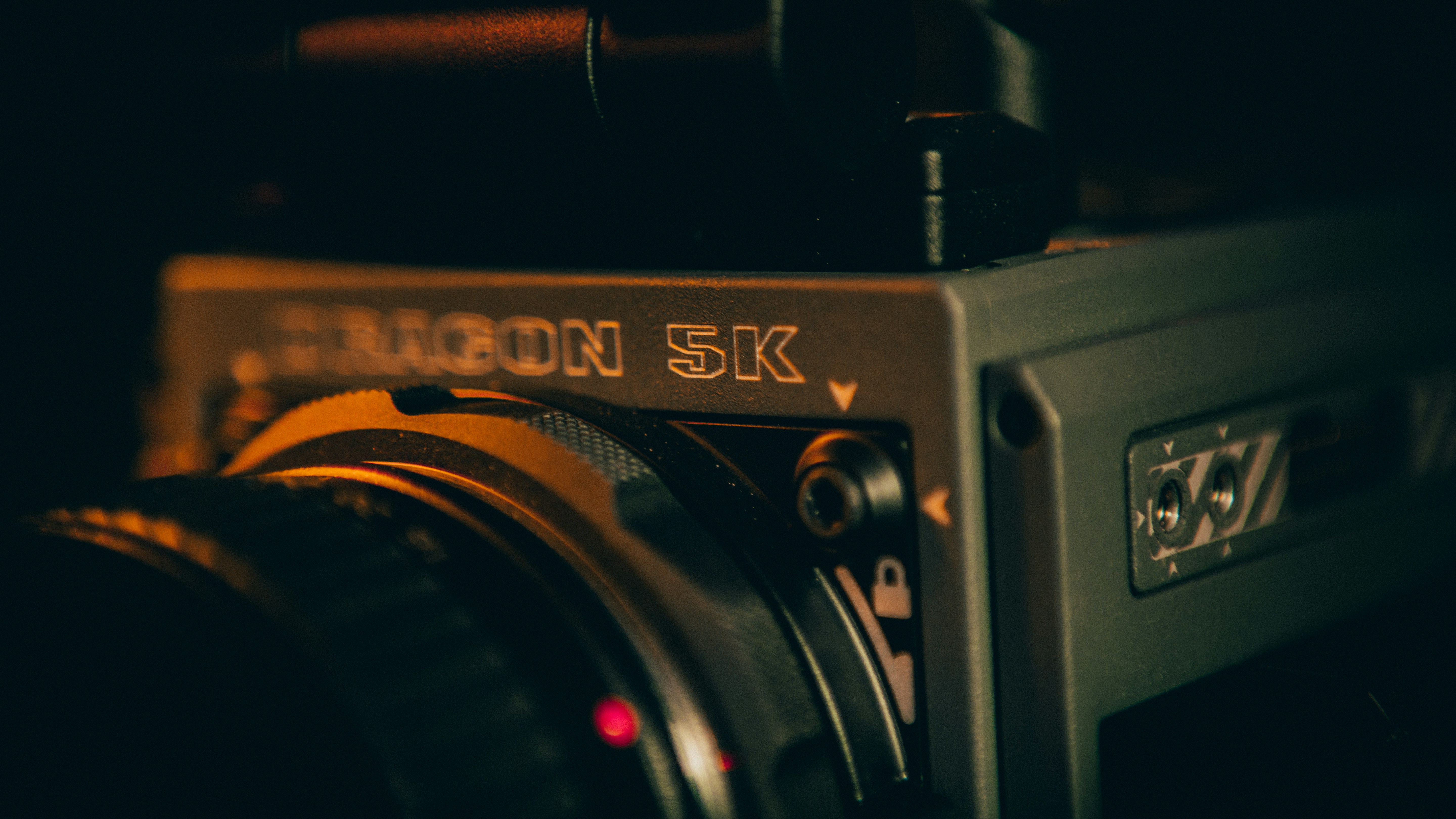 black and silver camera on brown wooden table