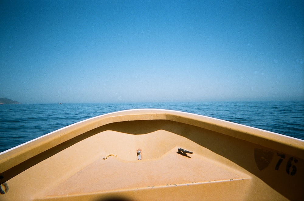 white and brown boat on sea during daytime