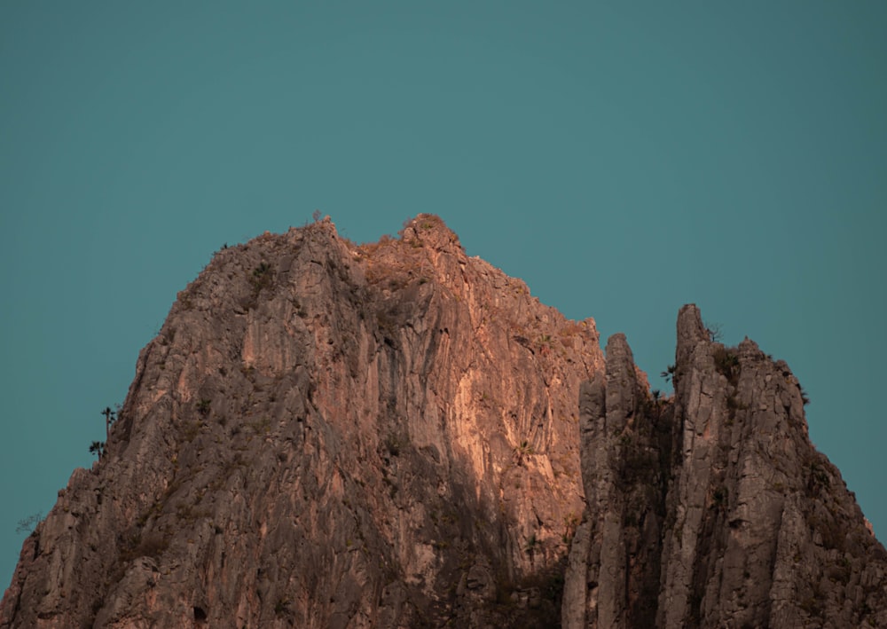 brown rocky mountain under blue sky during daytime