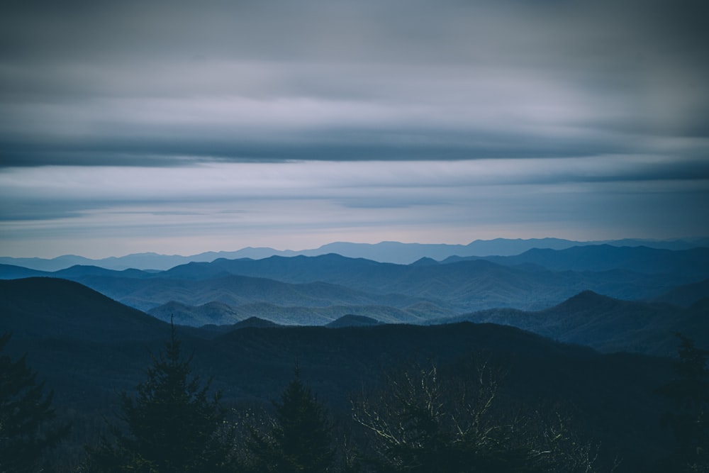 black mountains under white clouds during daytime