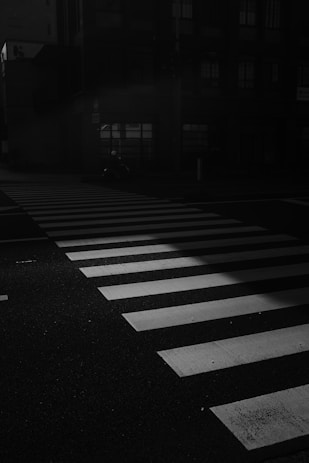 grayscale photo of pedestrian line