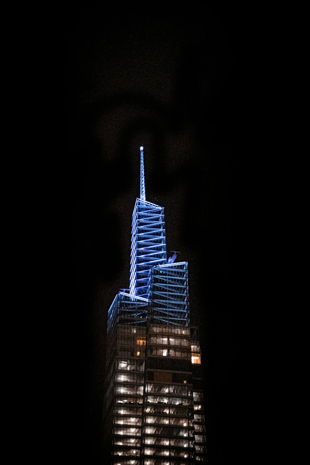 a very tall building lit up at night