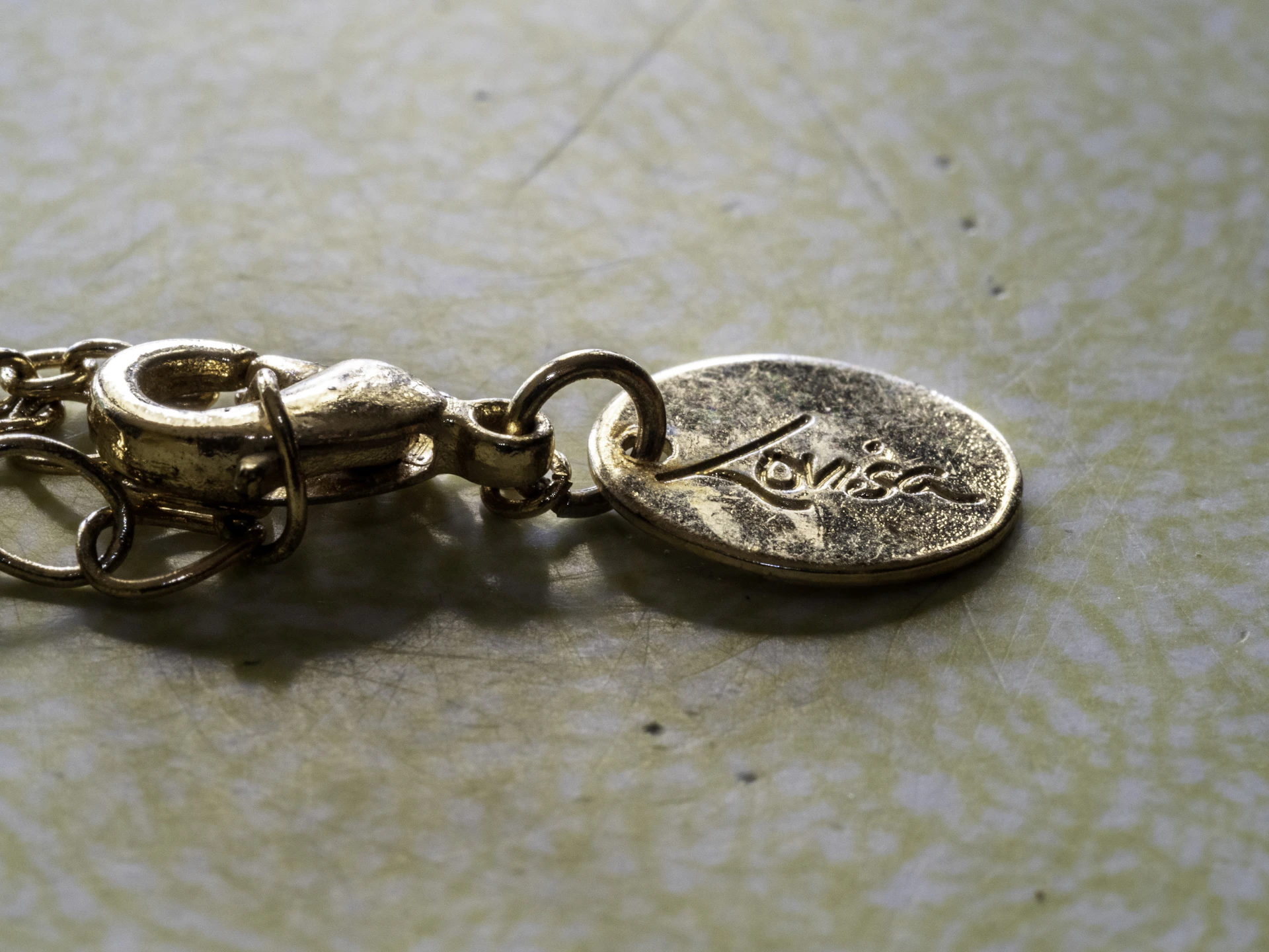 An elegant display of the same necklace from a different angle, highlighting its unique clasp and design.