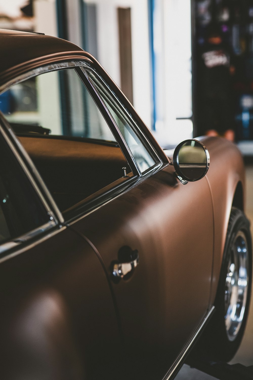 brown car in a parking lot during daytime