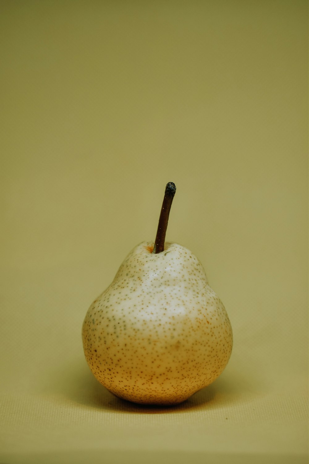 yellow fruit on white table