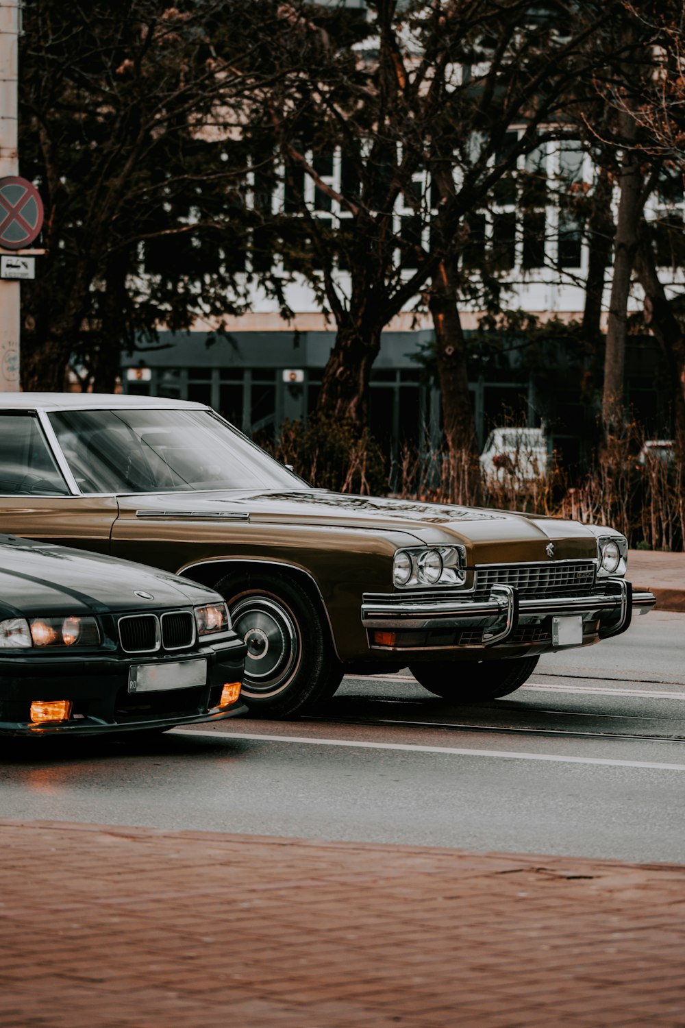 brown mercedes benz car on road during daytime