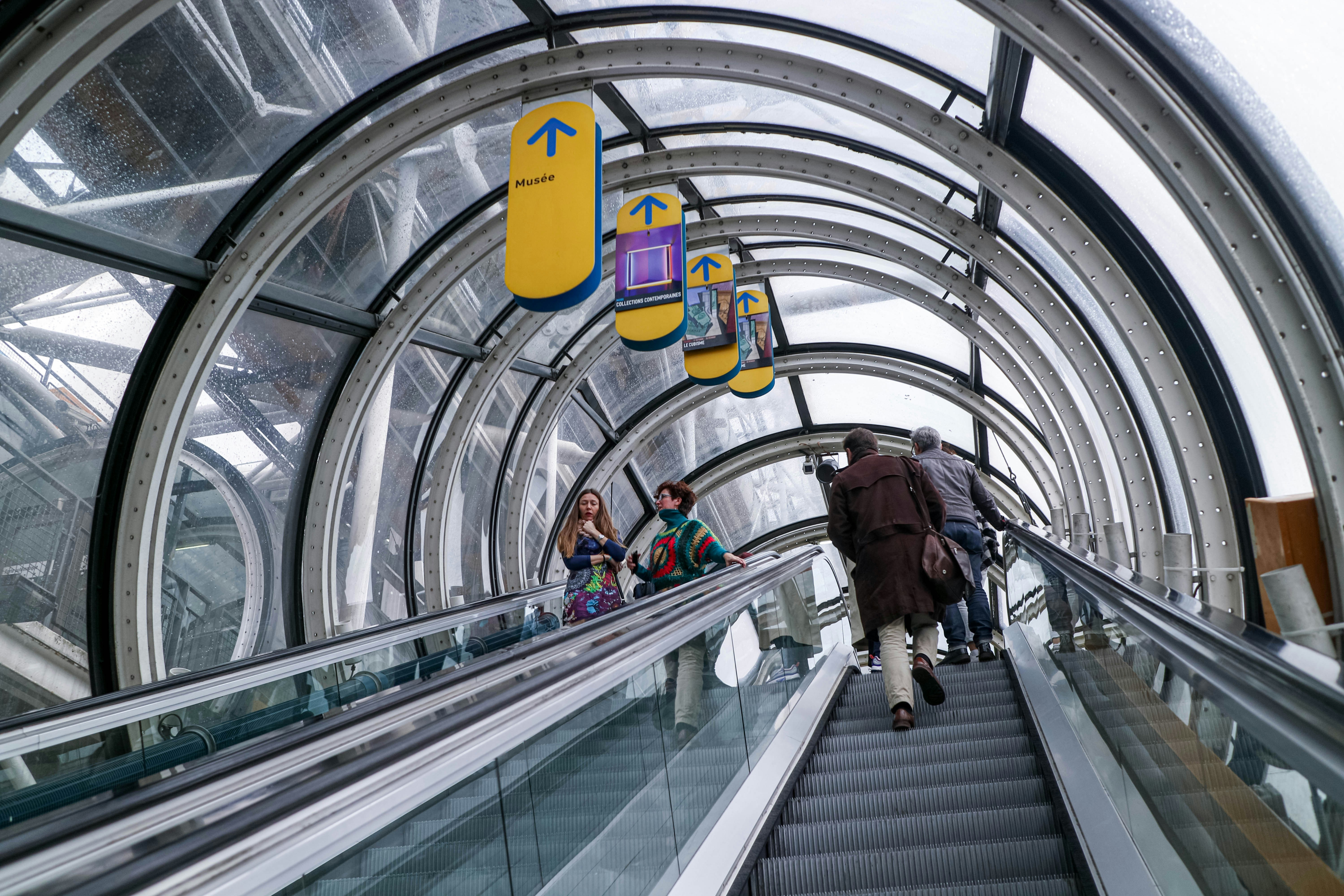 people walking on escalator inside building, Pompidou Centre main escalator, Paris, France