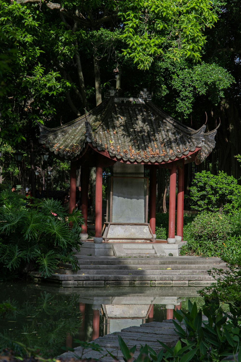 brown and gray concrete temple near green trees during daytime