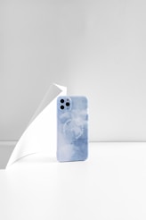 blue and white dice on white table