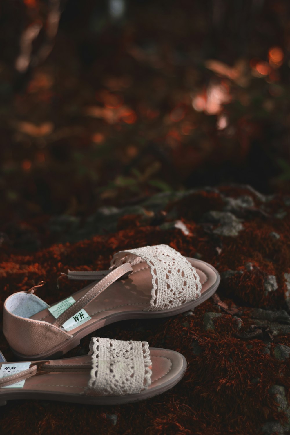 white and brown floral flat sandals