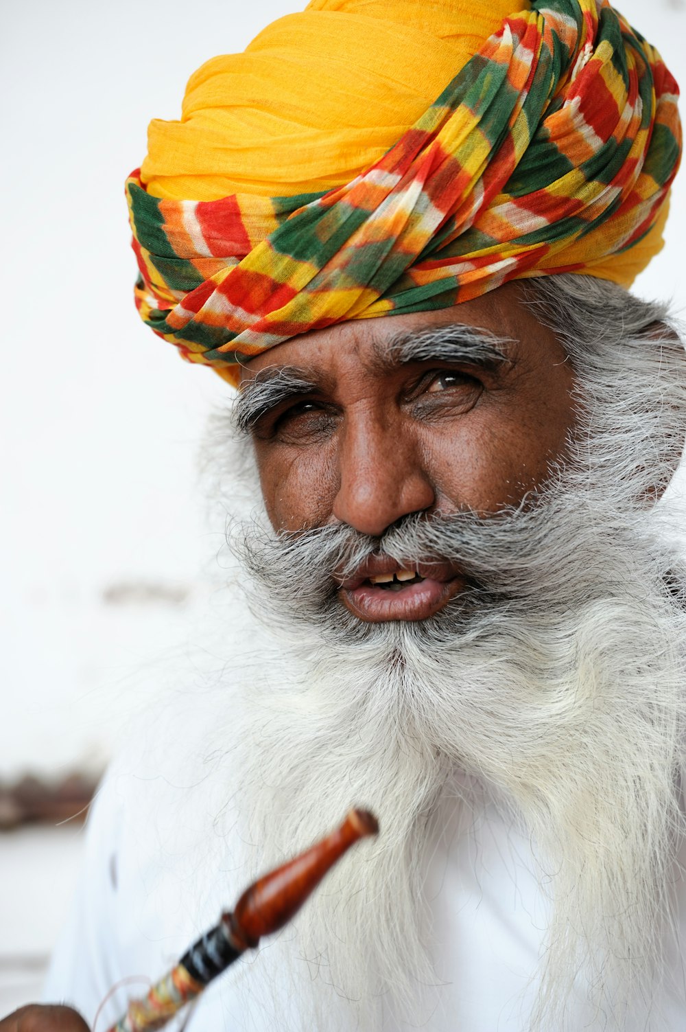 man in white and yellow hat