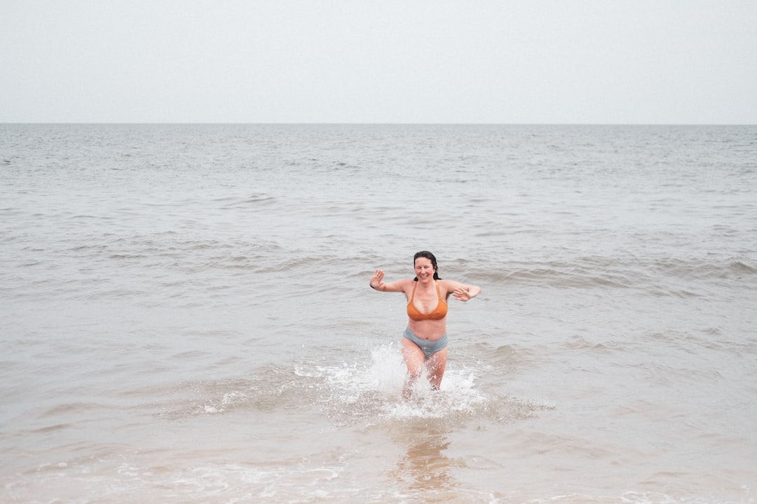 woman in blue bikini on beach during daytime