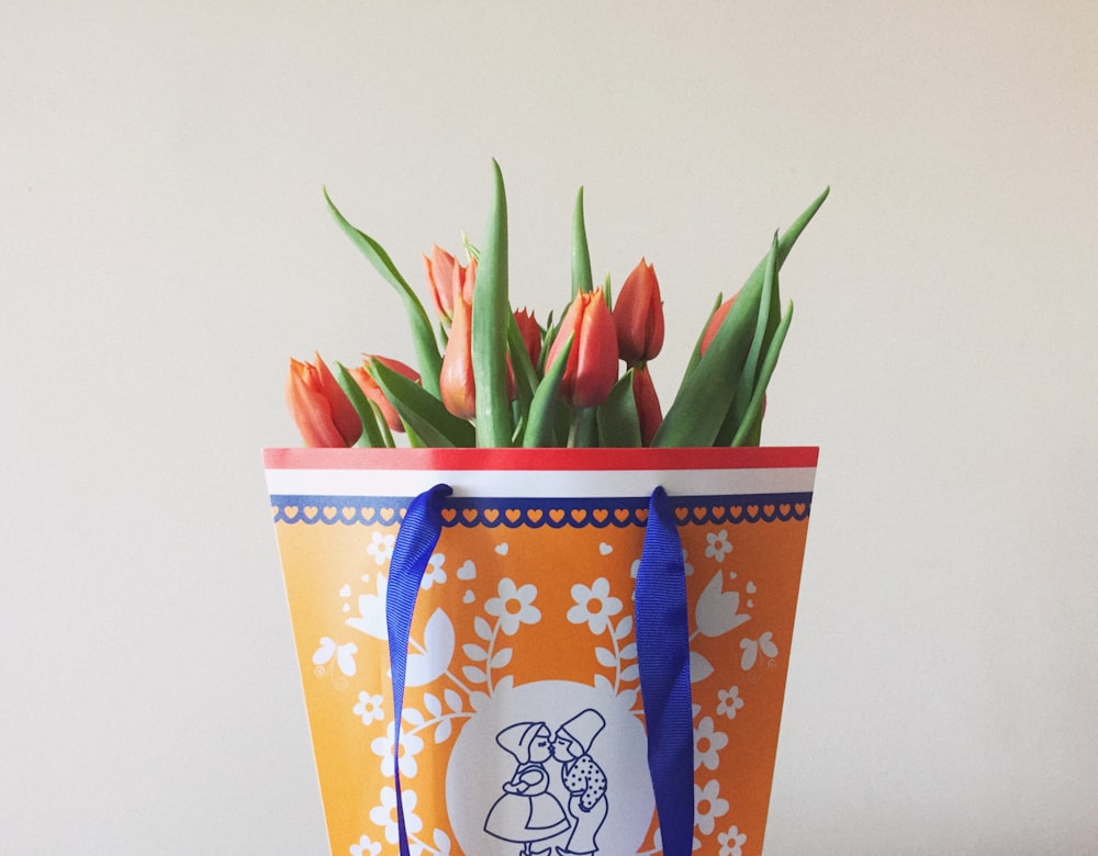 orange and white floral paper bag