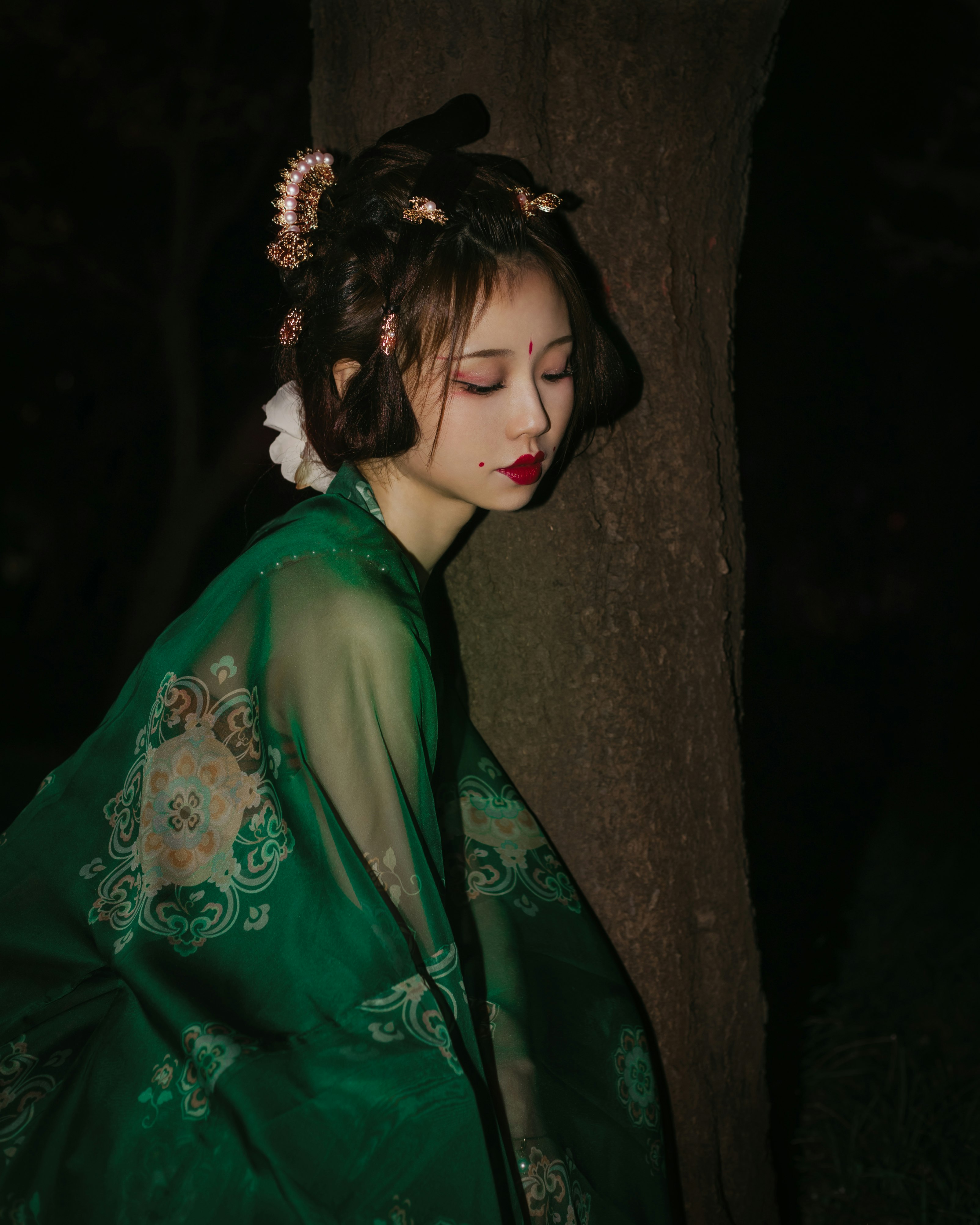 woman in green and white floral robe
