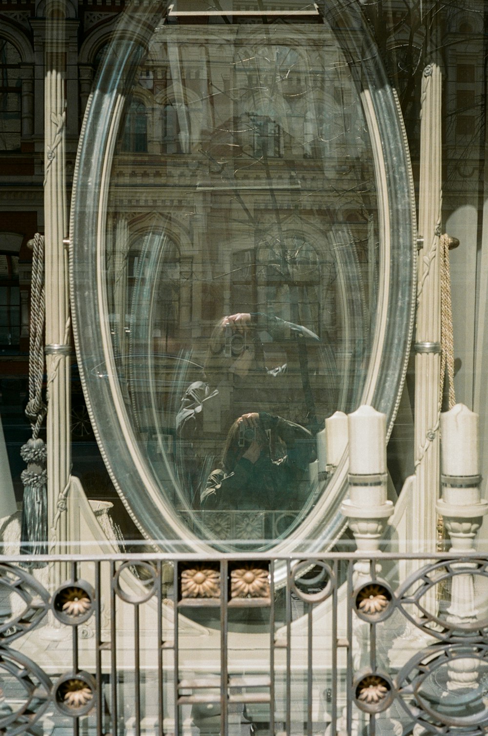 round gray framed glass mirror