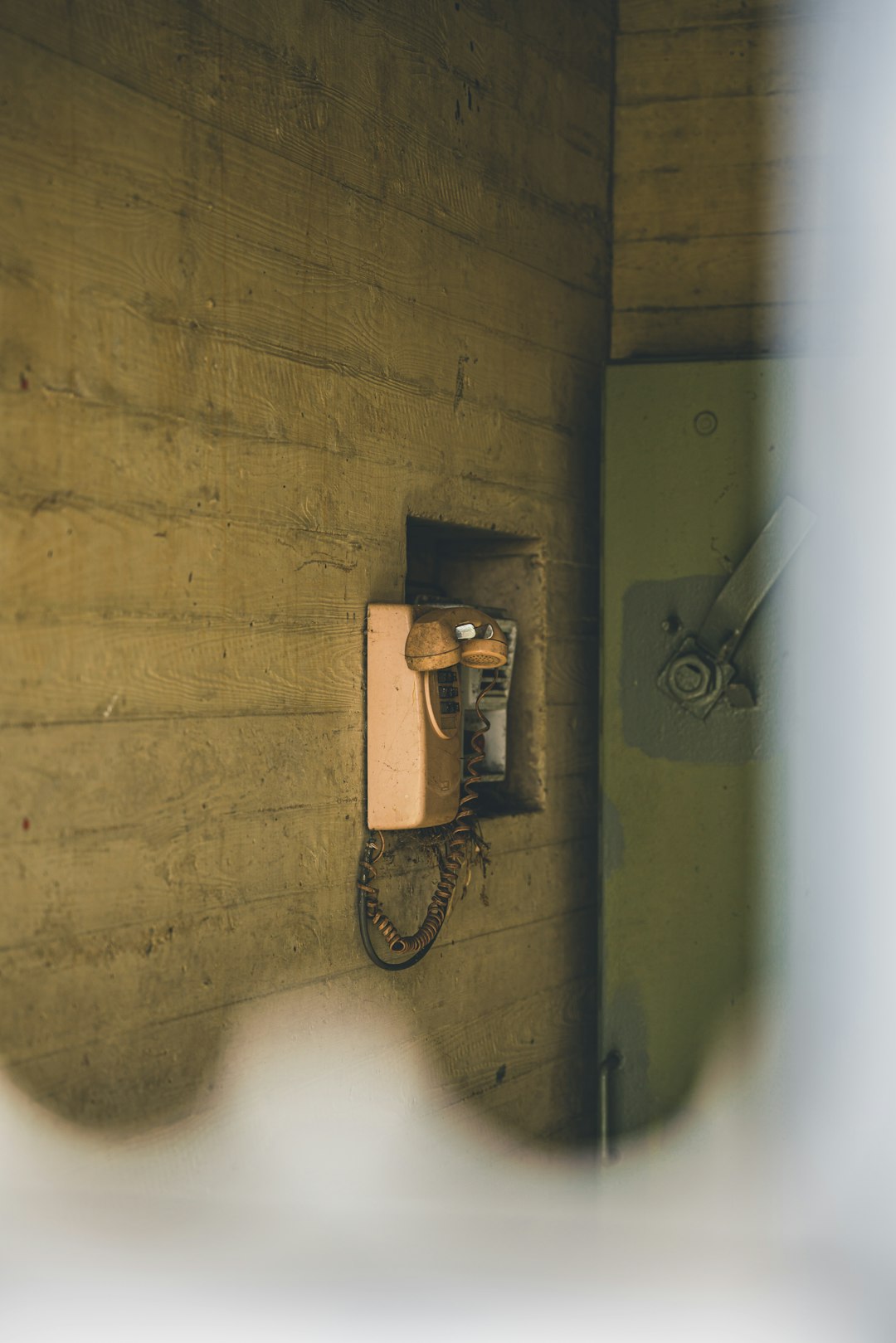 black and silver wall mounted telephone