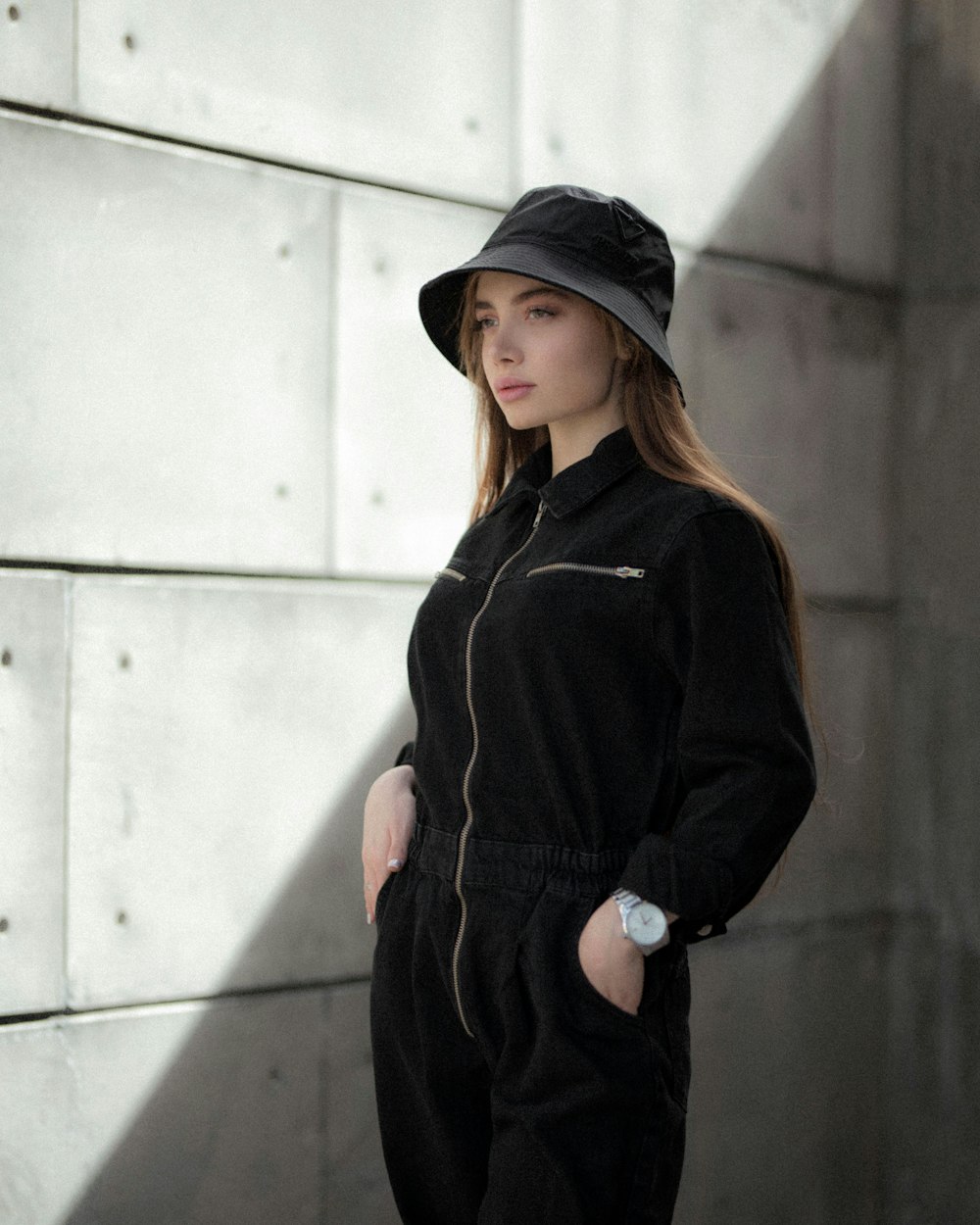 woman in black coat and black knit cap