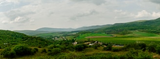 A panoramic view of a lush green field in England, ready for development.