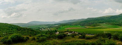 A panoramic view of lush green fields in Ireland.