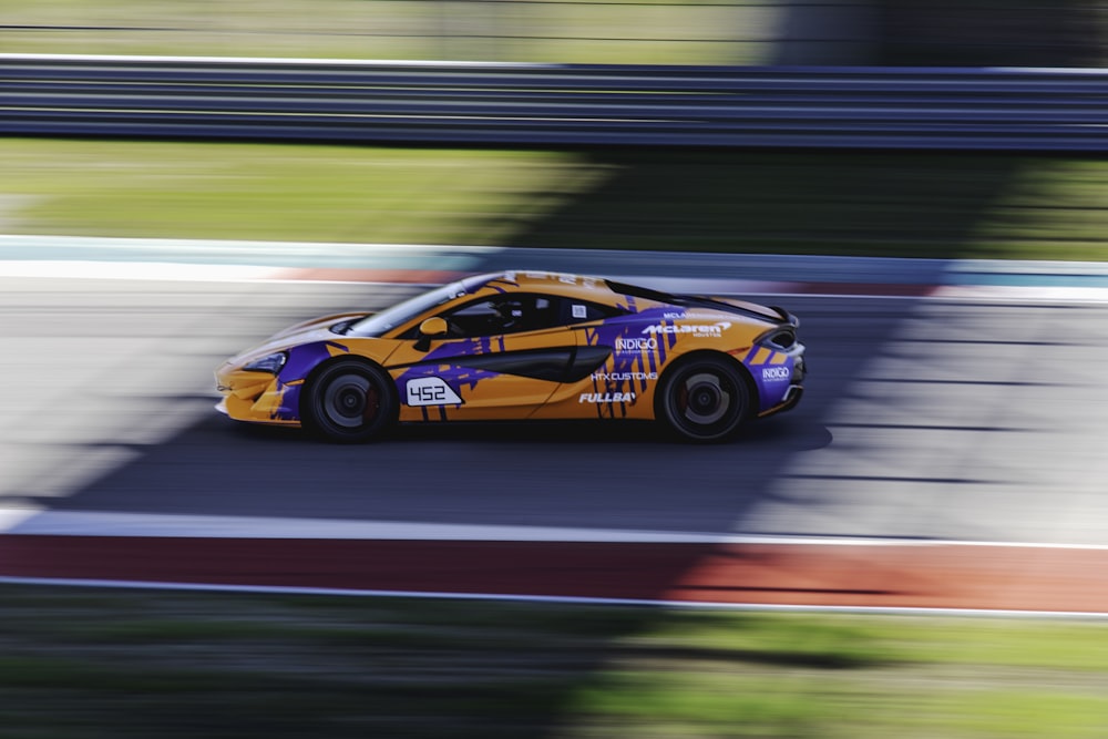 red and black race car on track