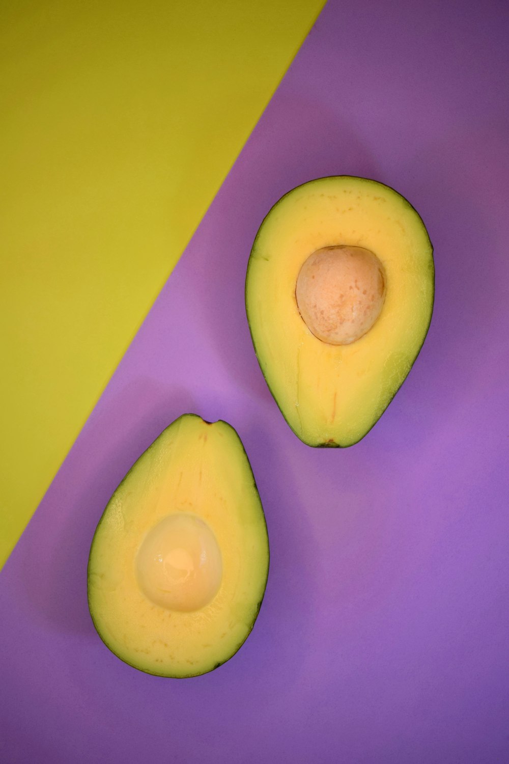 sliced apple on purple surface