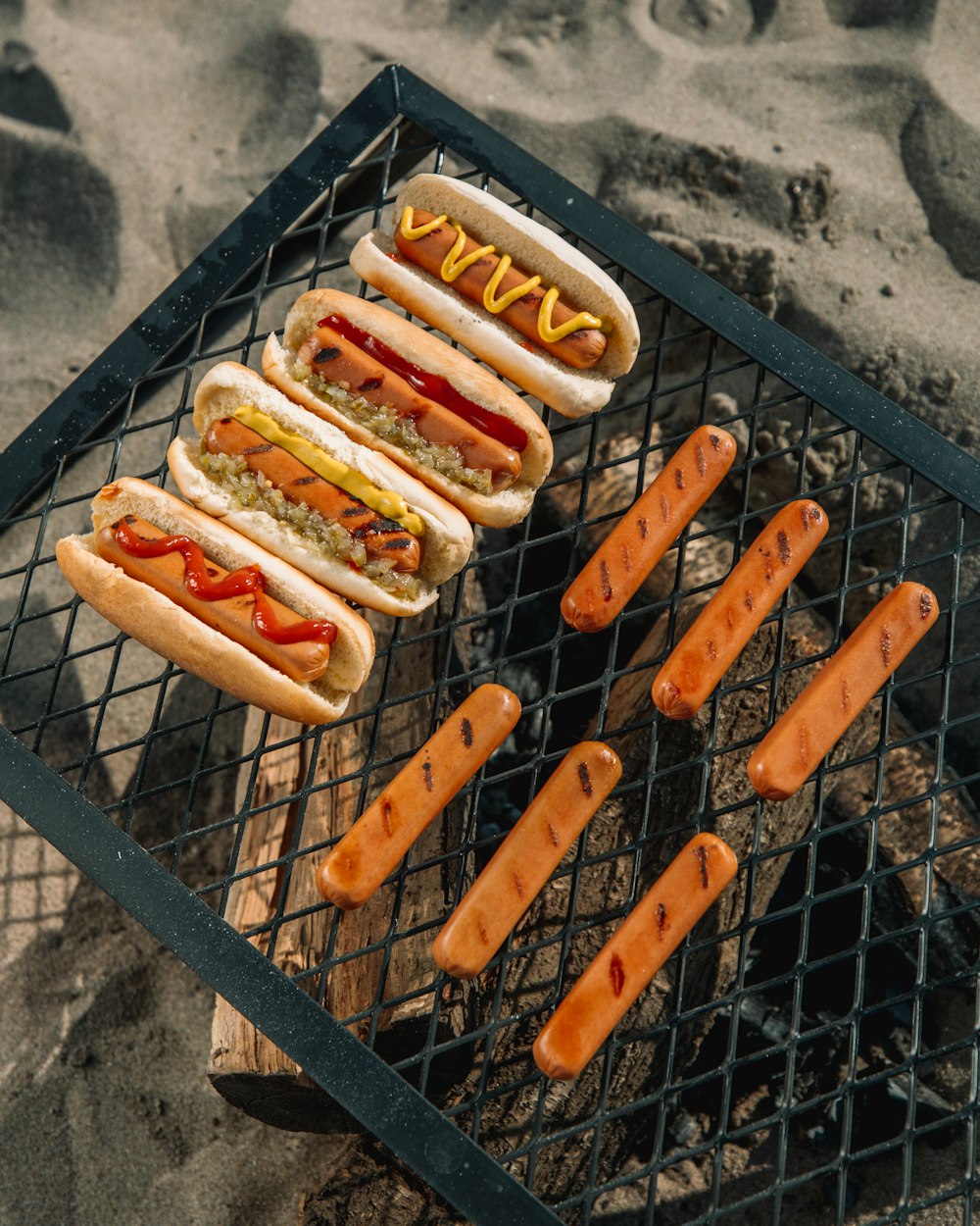 hotdog sandwich on black metal grill
