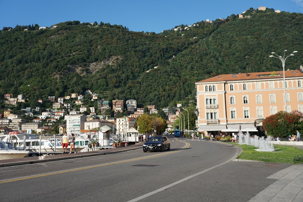 cars parked on roadside near building during daytime