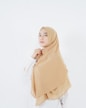 woman in beige hijab standing