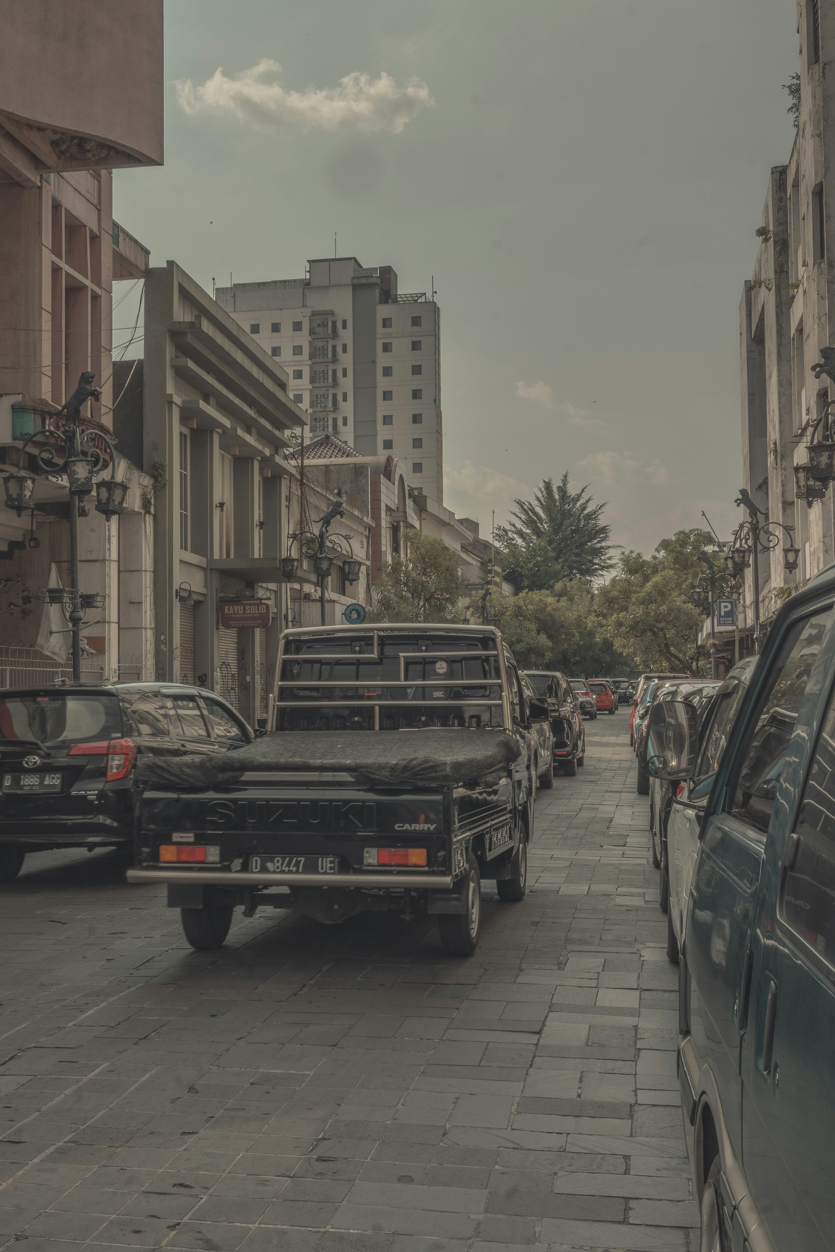 cars parked on the side of the road during daytime