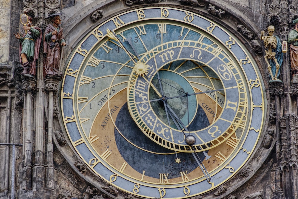 brown and black round analog clock