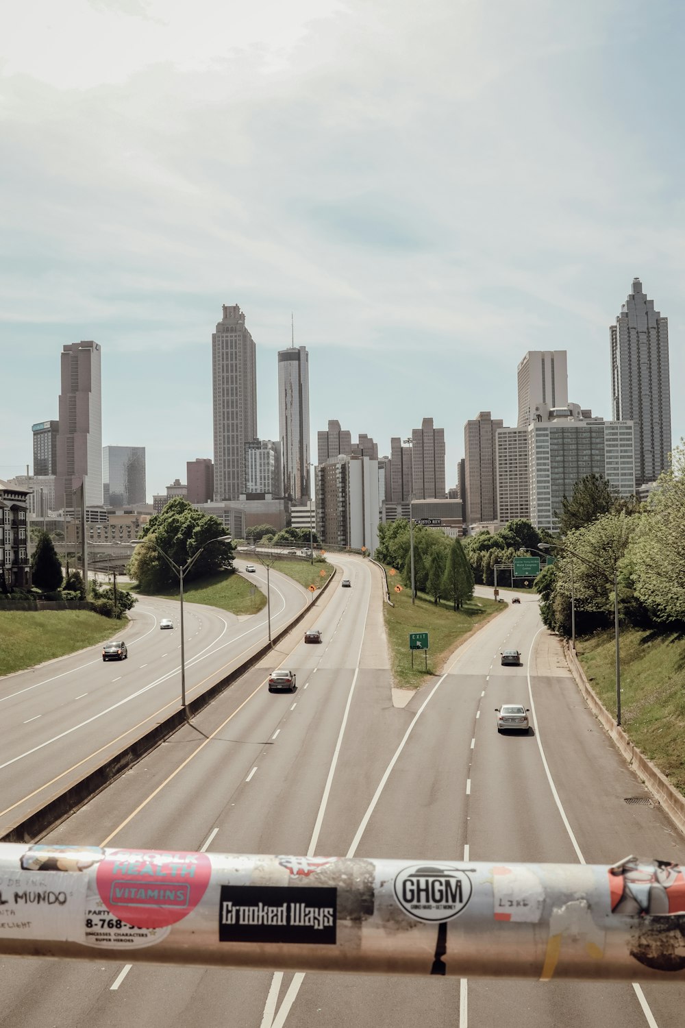 cars on road near city buildings during daytime