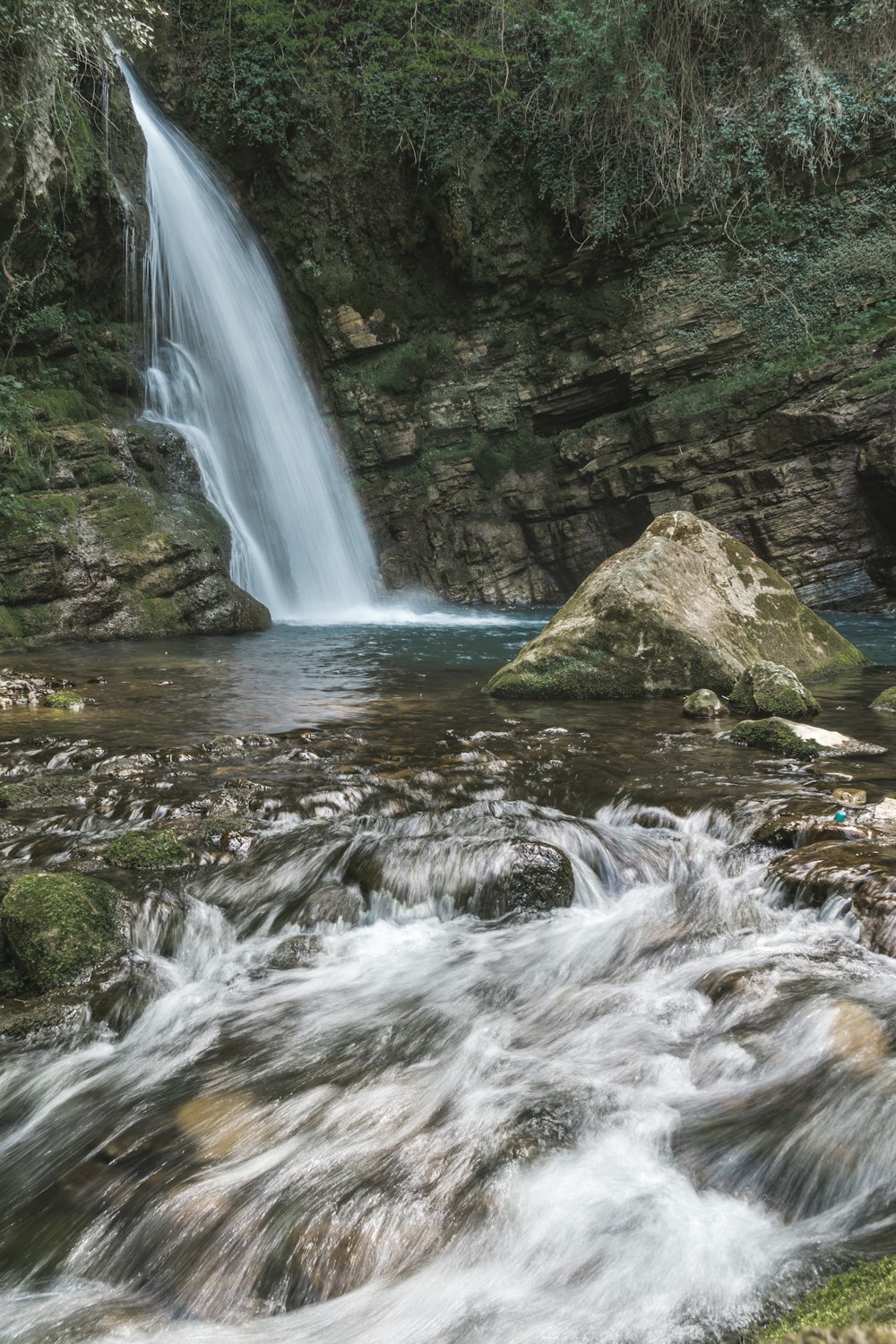 water falls on rocky mountain