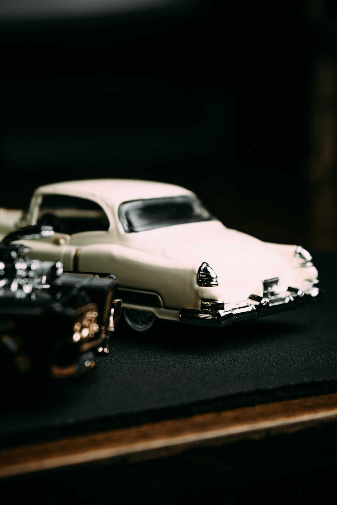 white car scale model on black table