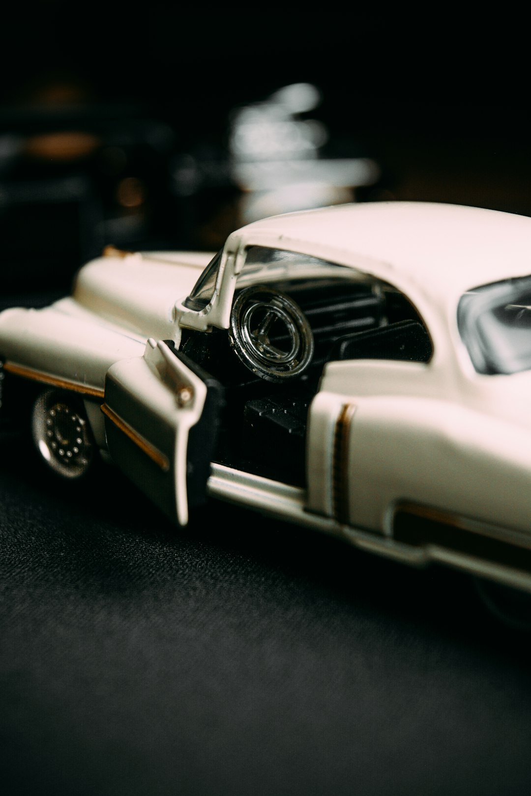 white and black classic car scale model