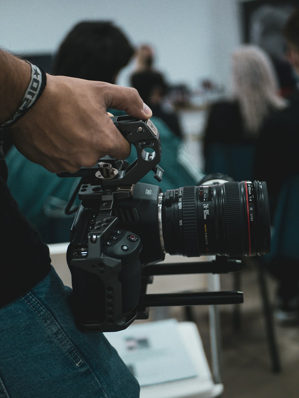 person holding black dslr camera