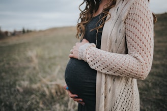 woman in white knit scarf and black dress