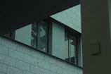 Close-up of architectural details featuring clean lines and textured materials in a modern building.
