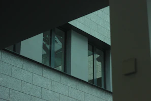 Close-up of architectural details featuring clean lines and textured materials in a modern building.