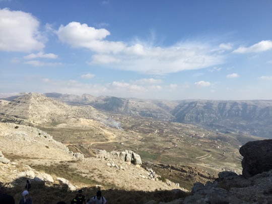 green and brown mountains under blue sky during daytime in Batroun Mountains Lebanon