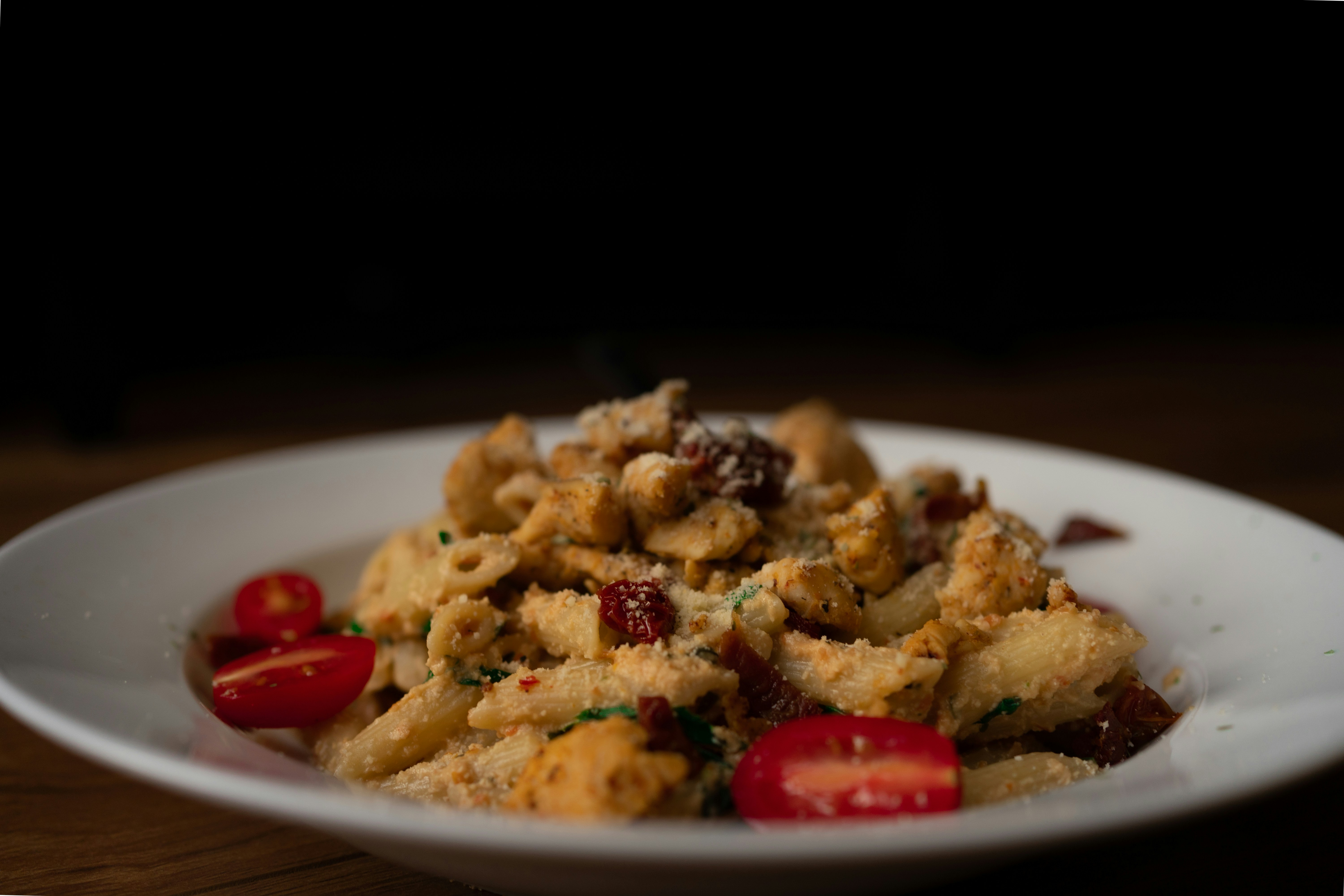 brown and red food on white ceramic plate stuffing teams background
