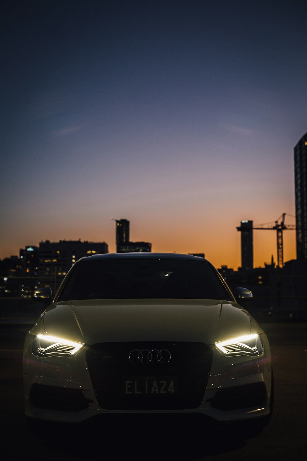 white car on road during sunset