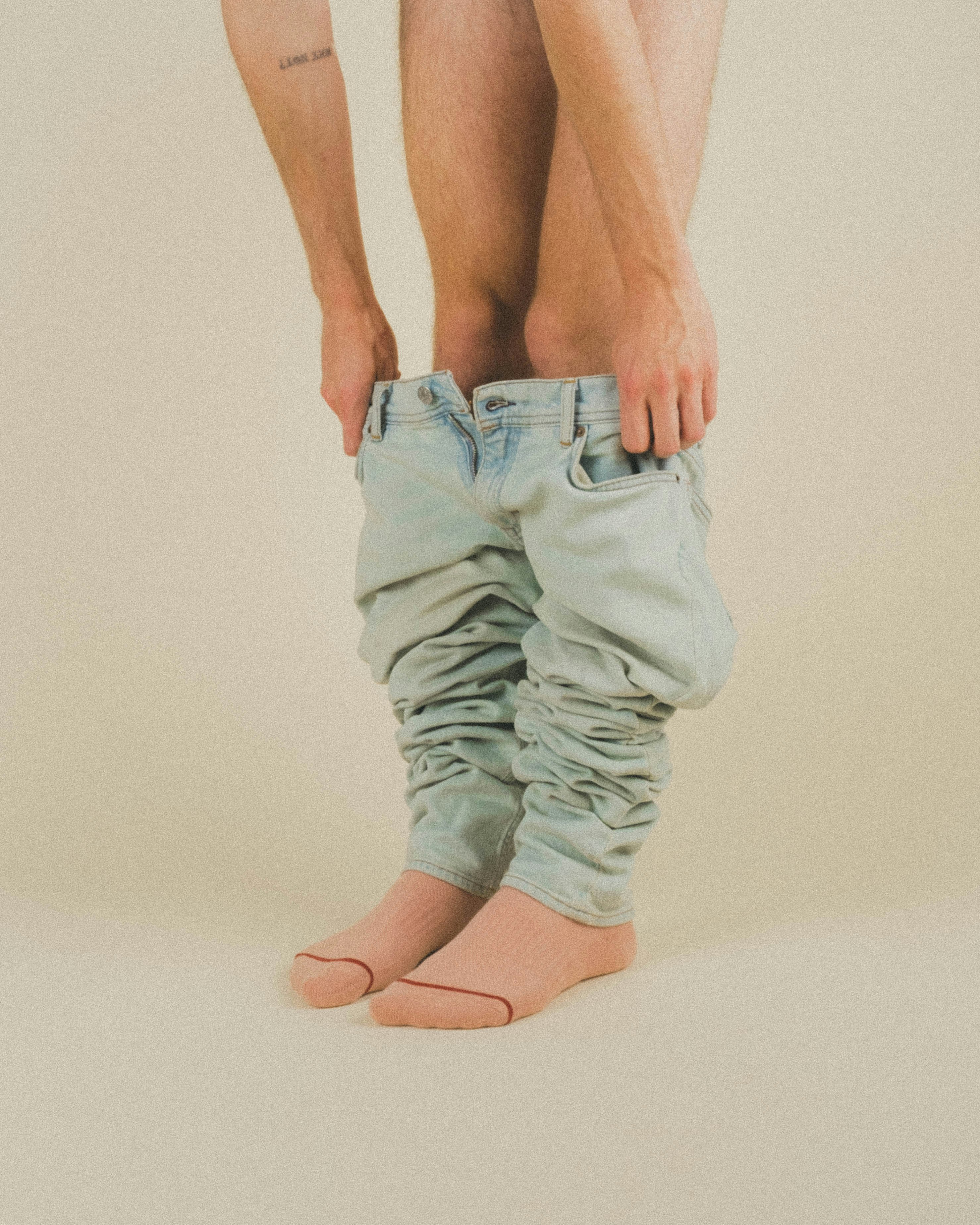 person in gray denim jeans
