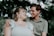 man in gray button up shirt holding woman in white dress