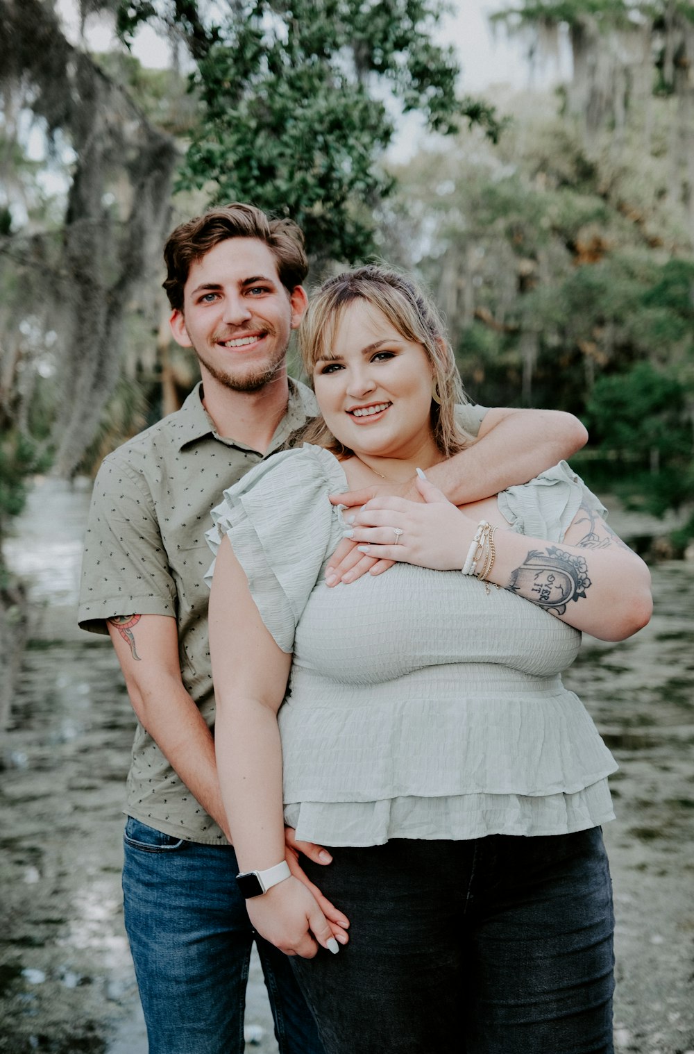 man in brown button up shirt hugging woman in blue denim jacket